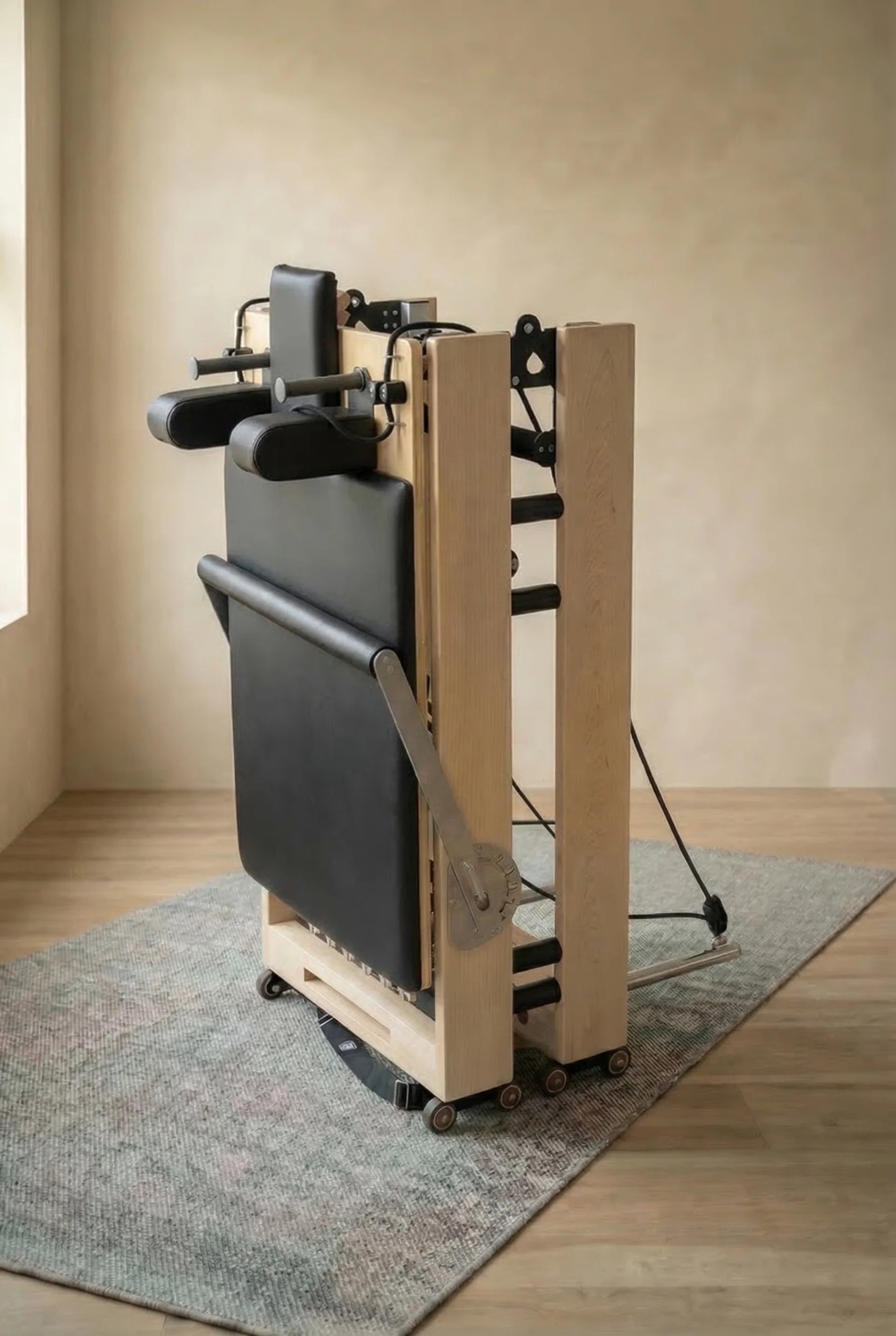 Moko foldable Pilates reformer in use at home