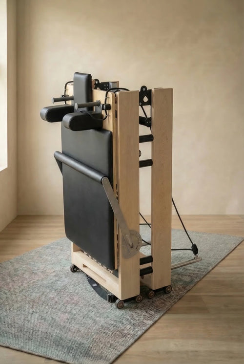 Moko foldable Pilates reformer in use at home