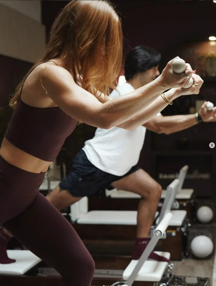 Lezione di Pilates con Reformer professionali pieghevoli