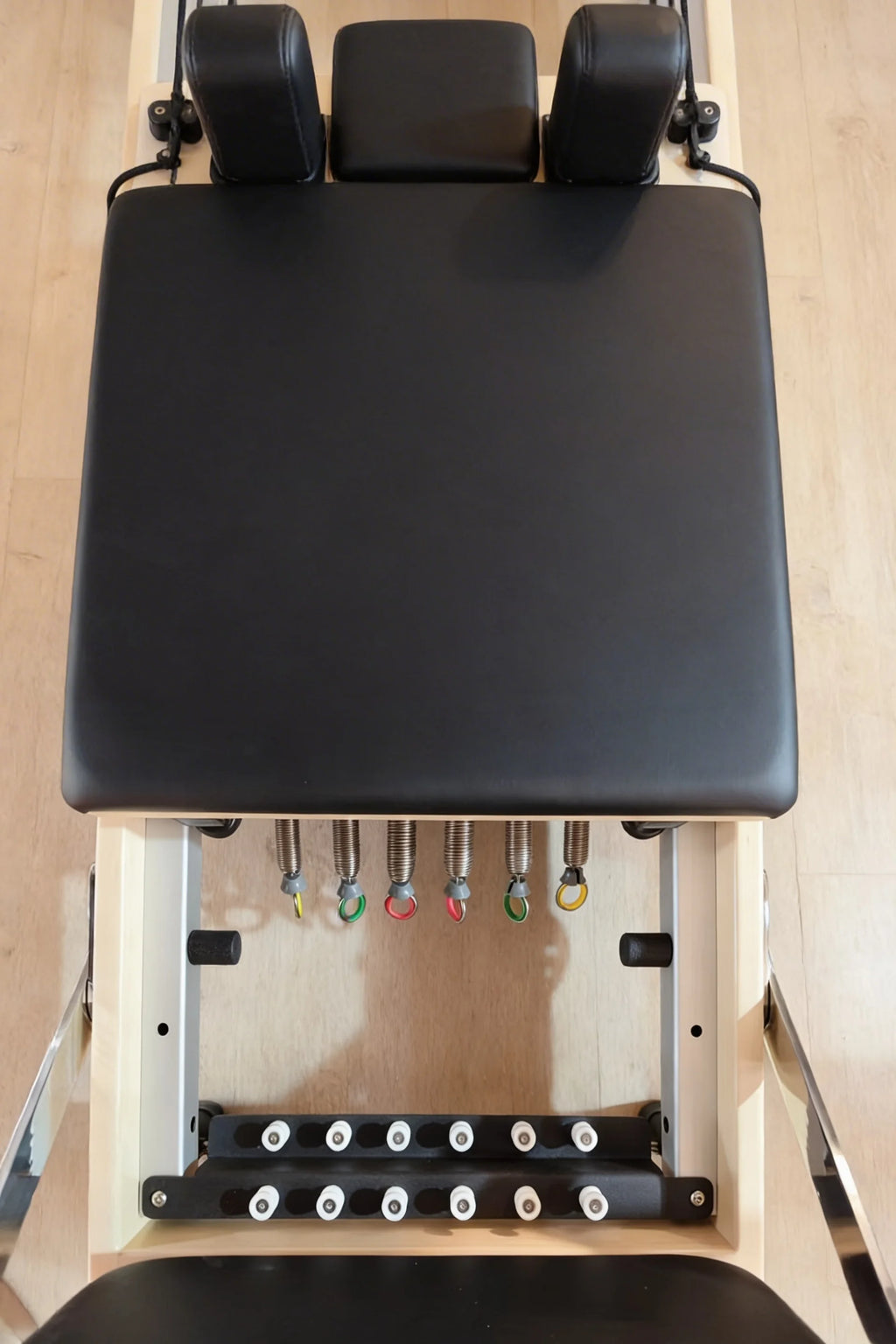 Moko Pilates reformer in a bright living room ready for use