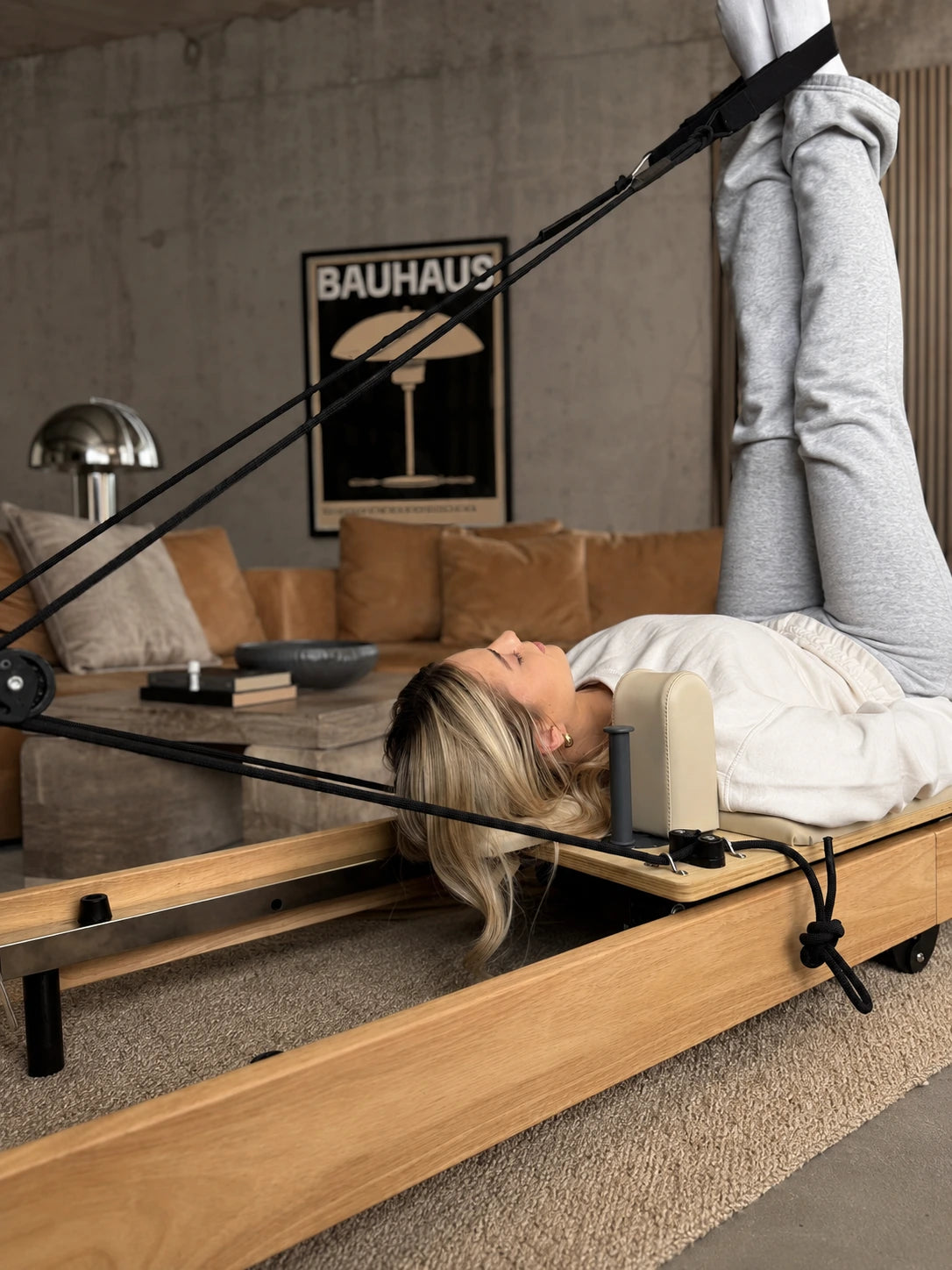 Esercizio su un Reformer Pilates pieghevole